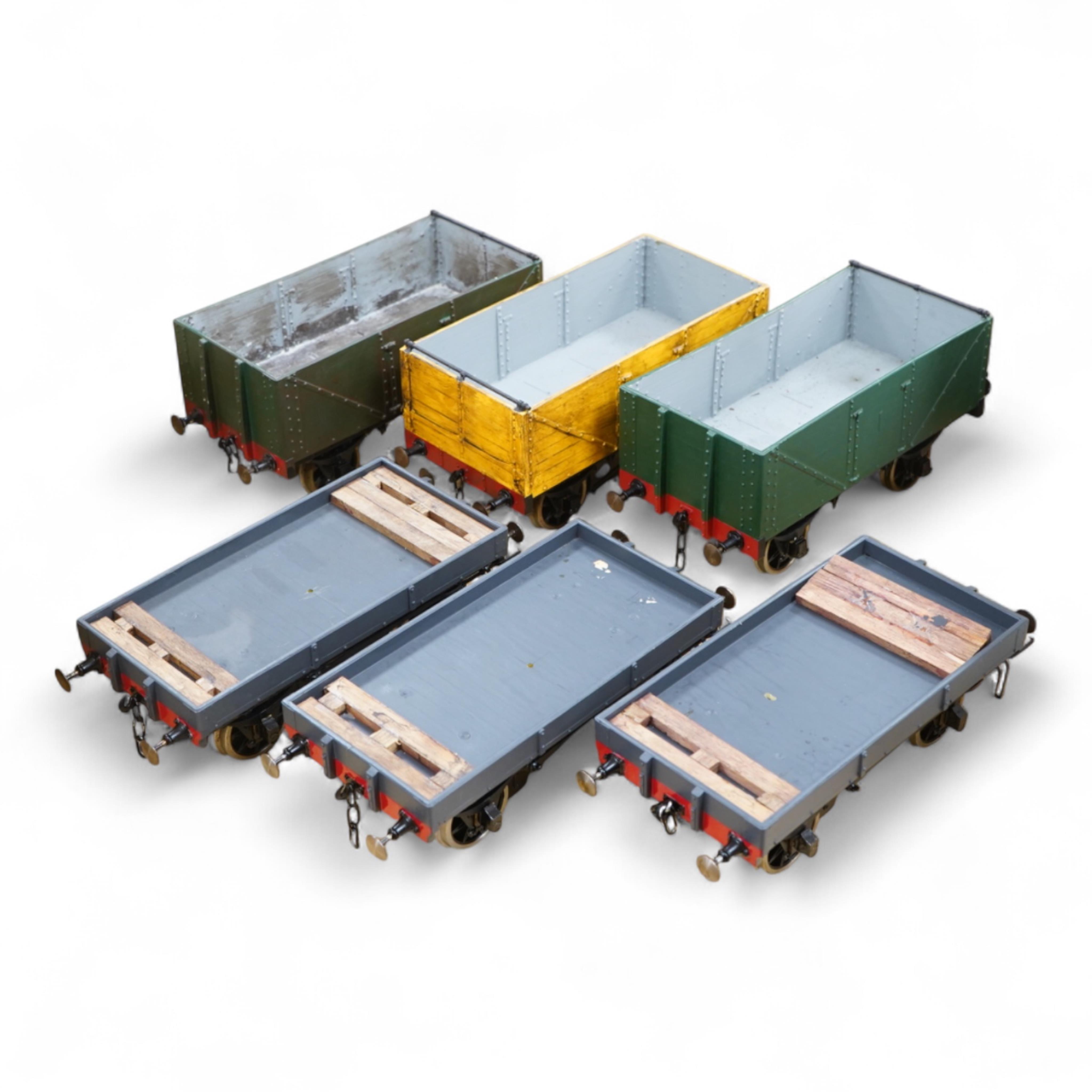Six Gauge 3 model Railway freight wagons; 3 flats and 3 opens all built from Mike Williams resin kits, well constructed and painted to a reasonable standard with some weathering, etc.